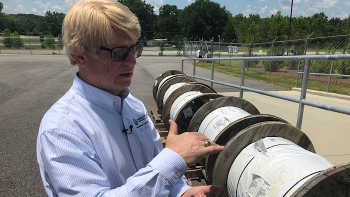 Steve Foshee, Ceo of Tombigbee, shows of the fiber optic reels the co-ops subsidiary will run in northwest Alabama. (Fox News/Charles Watson)