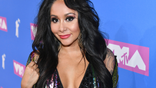 FILE - In a Monday, Aug. 20, 2018 file photo, Nicole "Snooki" Polizzi arrives at the MTV Video Music Awards at Radio City Music Hall, in New York. Reality TV personality Nicole “Snooki” Polizzi has welcomed her third child into the world. The “Jersey Shore” cast member posted about the birth on Twitter Thursday, May 30, 2019, writing that Angelo James LaValle weighs 7½ pounds. The 31-year-old and husband Jionni LaValle were already parents of a 6-year-old boy and a 4-year-old girl. (Photo by Charles Sykes/Invision/AP, File)