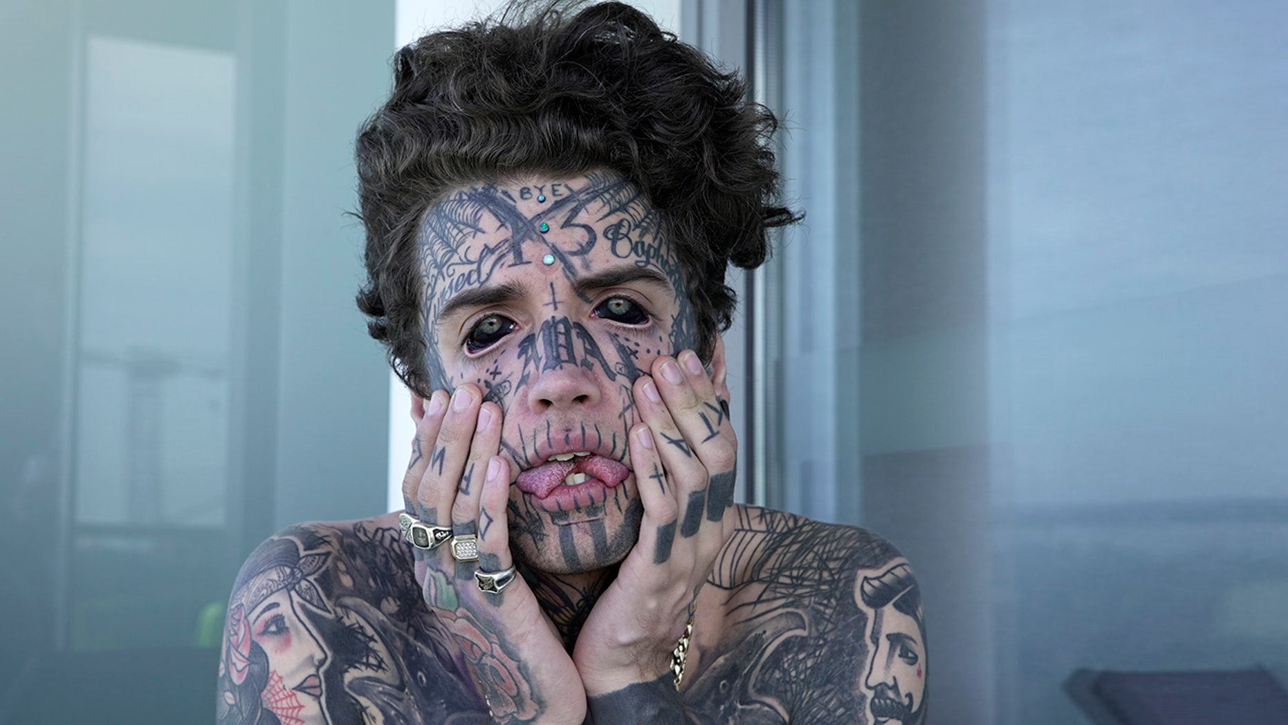 Ethan Bramble, from Melbourne, Australia has had a string of body modifications including getting his tongue split, the removal of his belly button and even tattooing his eyeballs black. (Alana Tompson / Barcroft Images / Barcroft Media via Getty Images)