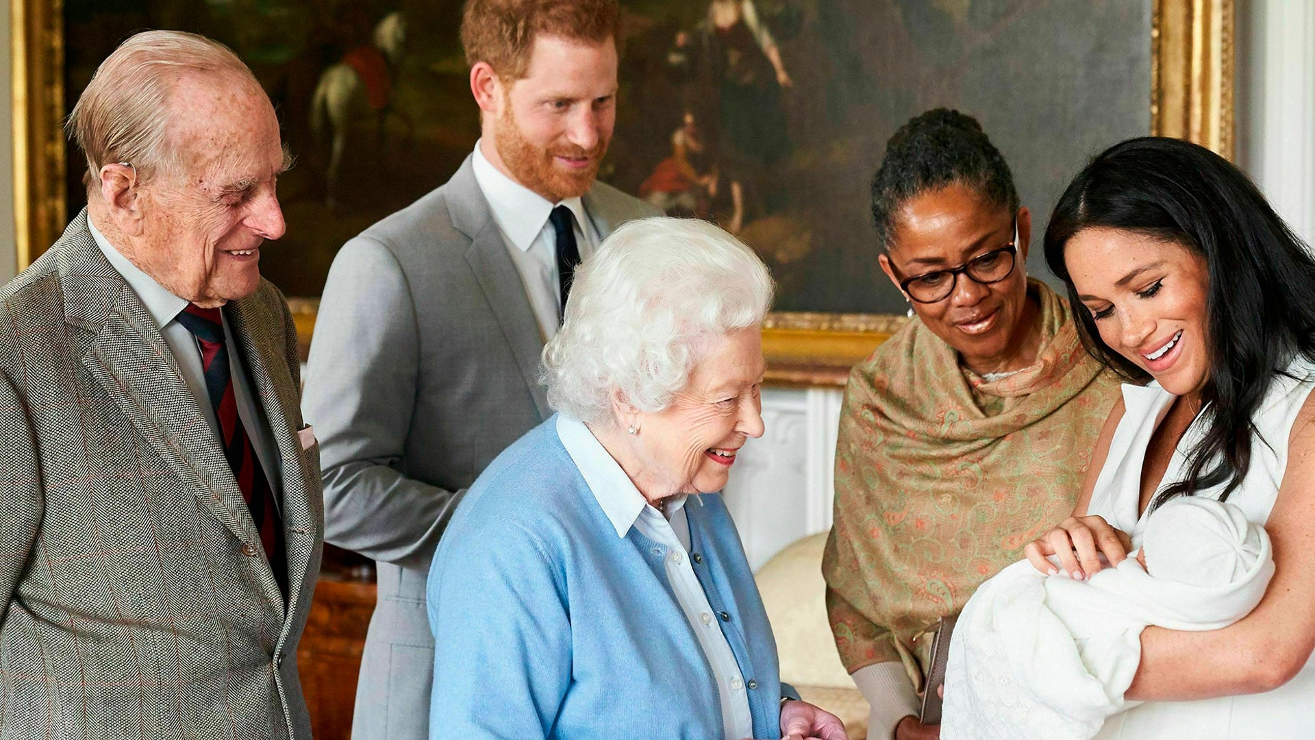 Britain's Prince Harry and Meghan, Duchess of Sussex, joined by her mother Doria Ragland, show their new son Archie to Queen Elizabeth II and Prince Philip at Windsor Castle, May 8, 2019.
