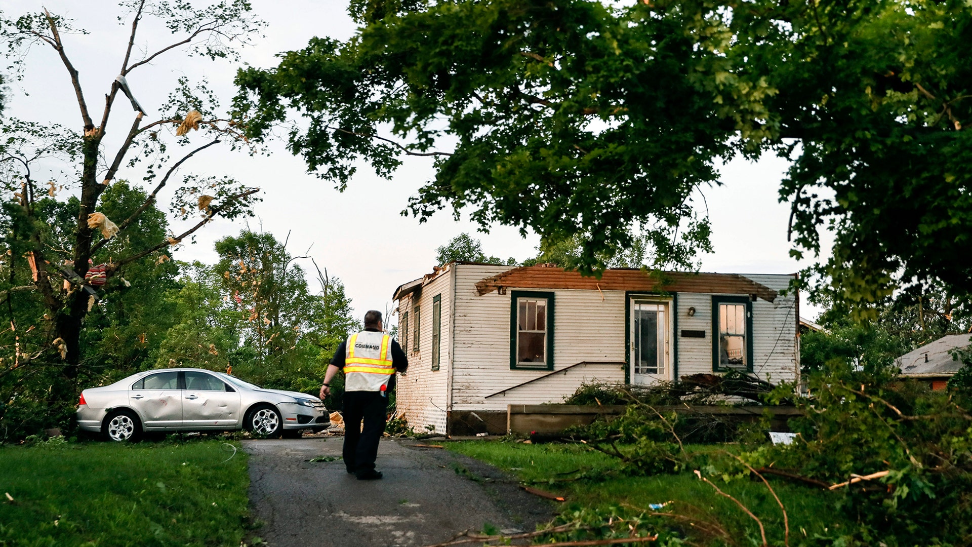 Storm damage litters a residential neighborhood in Dayton, Ohio, May 28, 2019.