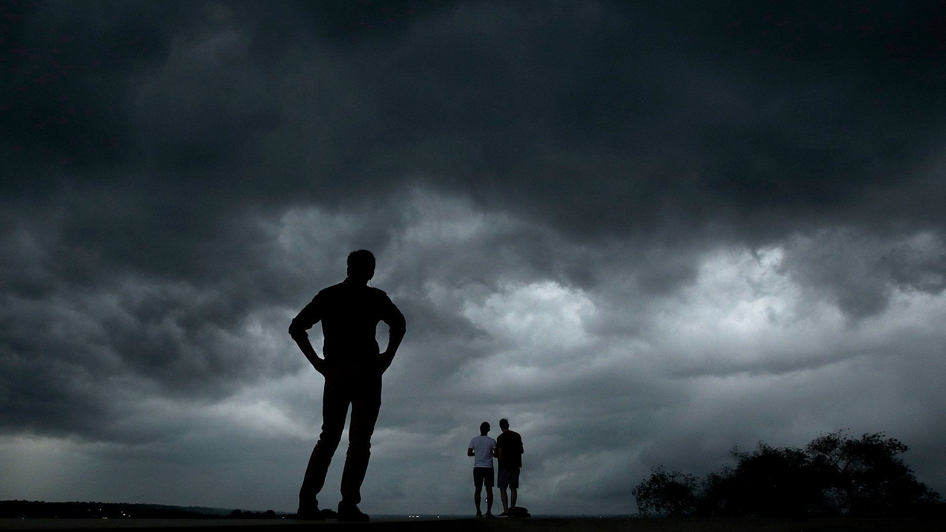 People watch from the Liberty Memorial as a severe storm that dropped several tornados earlier approaches downtown Kansas City, Missouri, May 28, 2019. 
