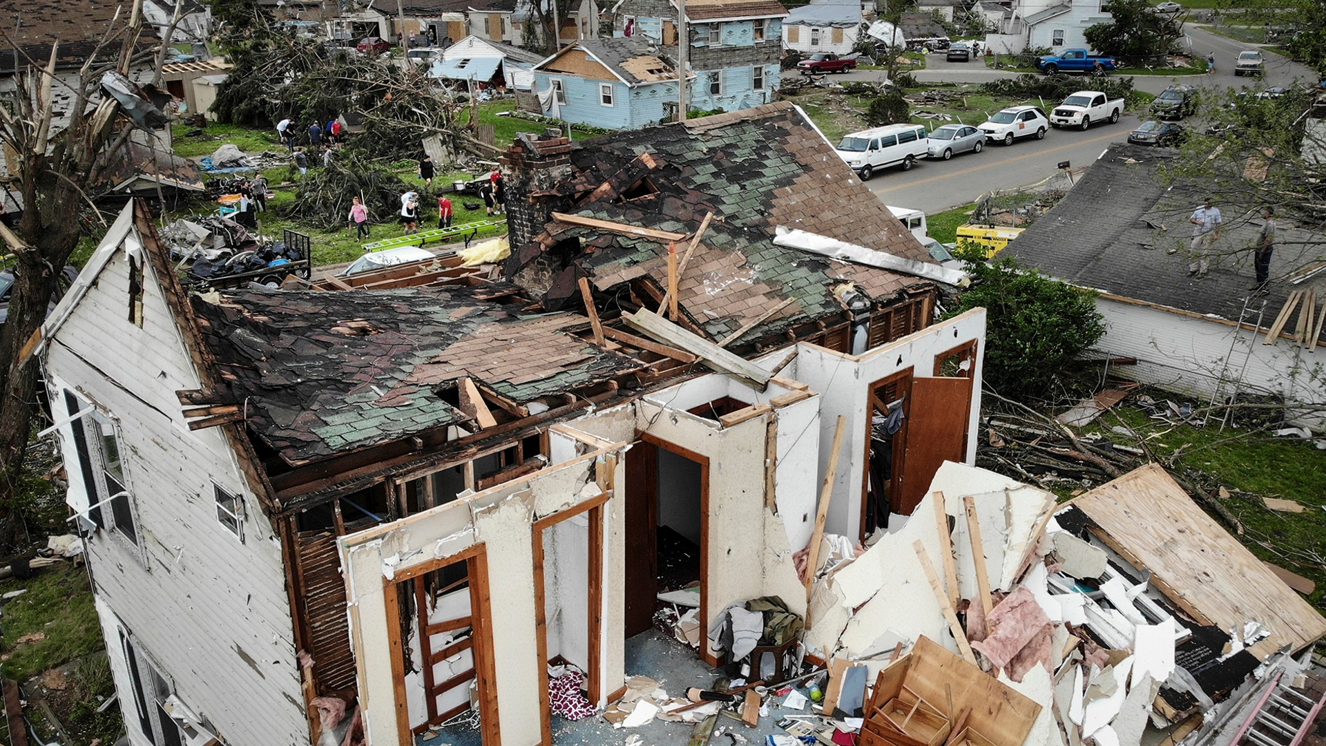 Repair and cleaning efforts begin on a neighborhood damaged by a tornado storm system that passed through Dayton, Ohio, May 29, 2019.