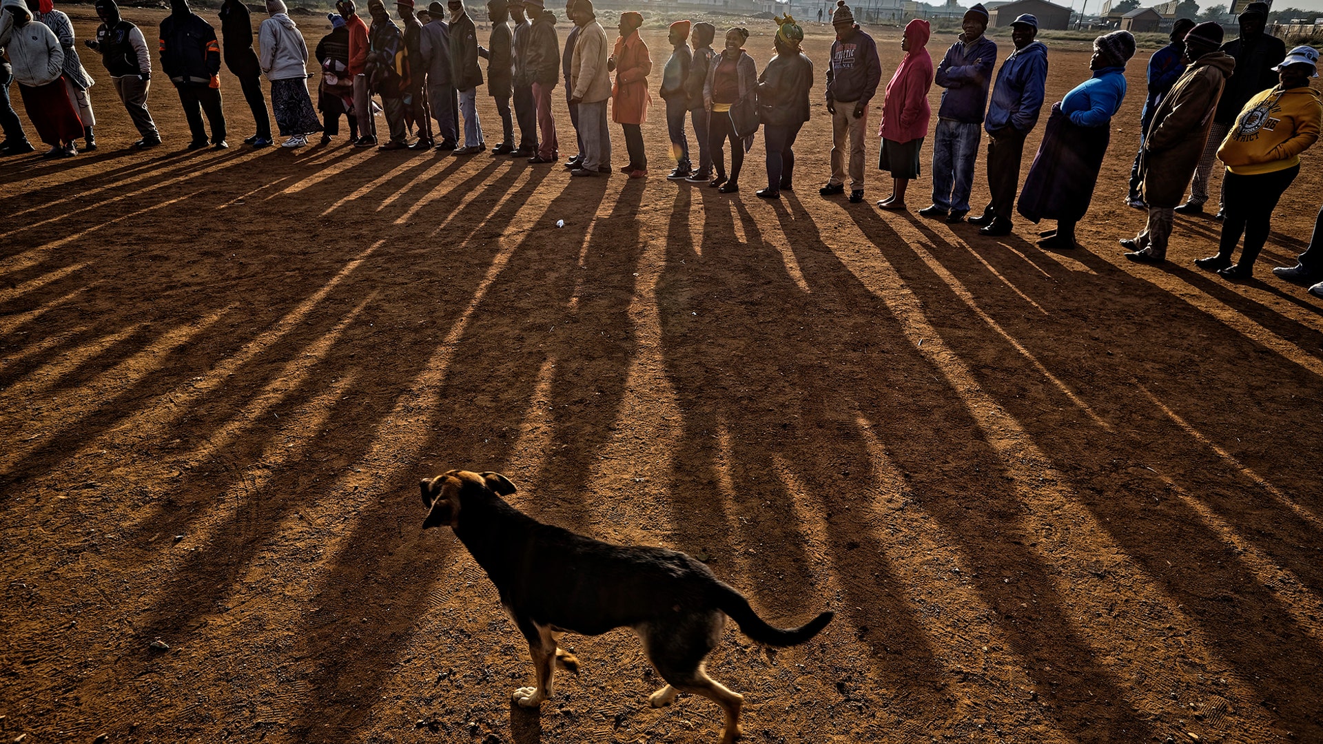 South Africans queue in the early morning sun to cast their votes in the mining settlement of Bekkersdal, west of Johannesburg, May 8, 2019. 