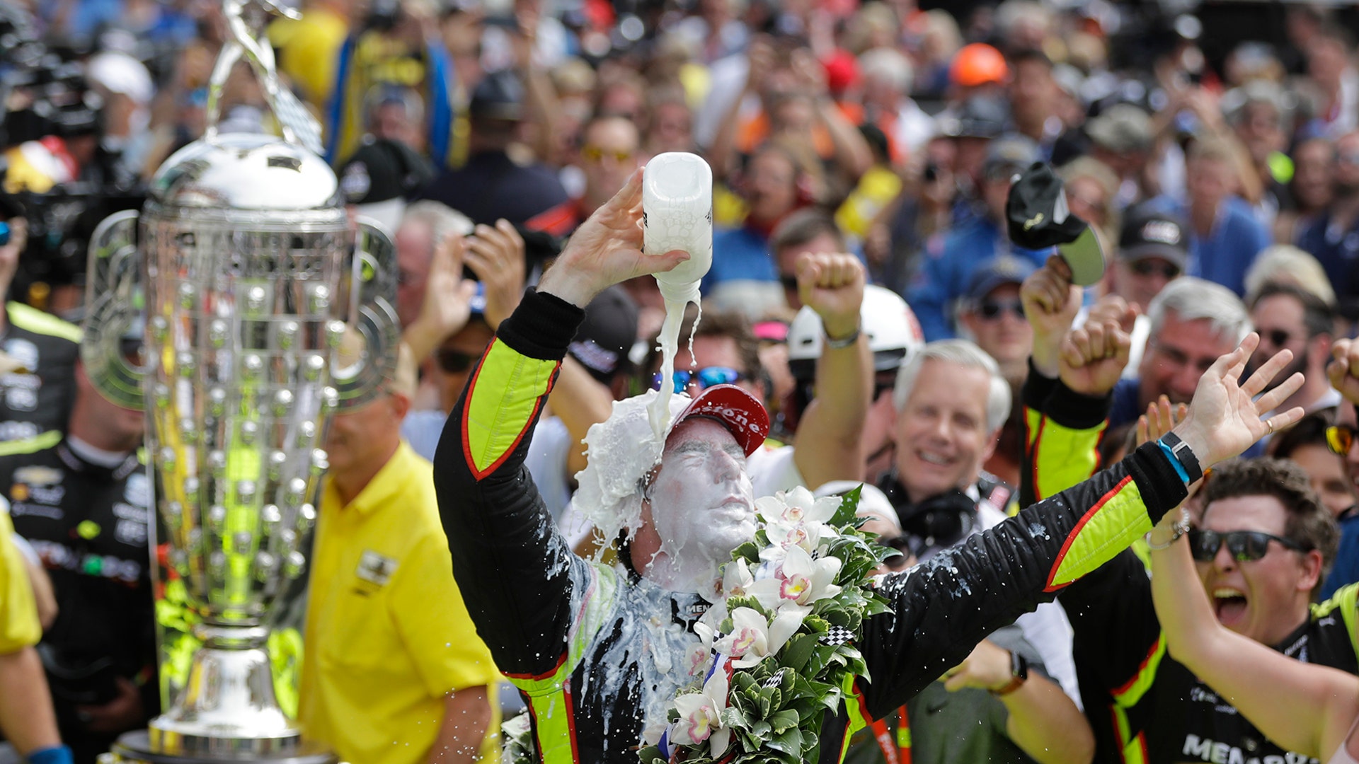 Simon Pagenaud, of France, celebrates after winning the Indianapolis 500 IndyCar auto race at the Indianapolis Motor Speedway, May 26, 2019. 