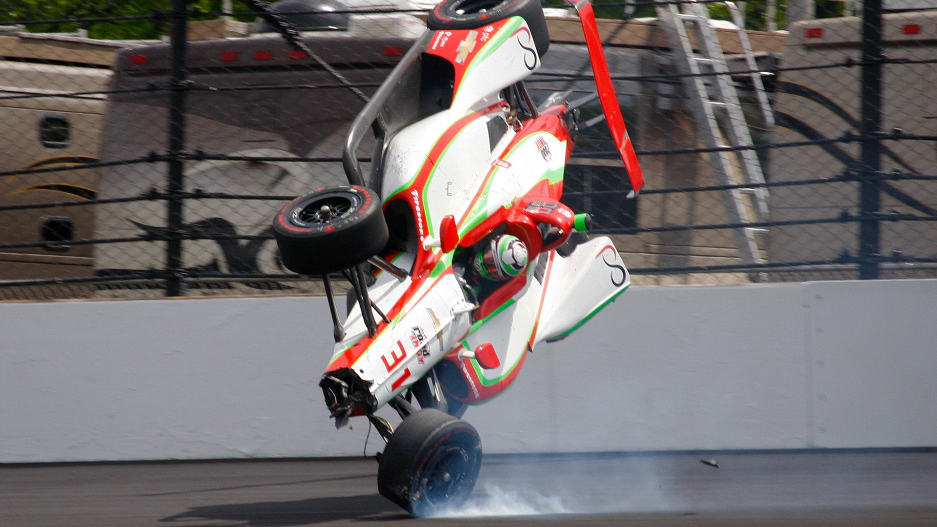 The car driven by Patricio O'Ward, of Mexico, goes airborne after hitting the wall in the second turn during practice for the Indianapolis 500 IndyCar auto race at Indianapolis Motor Speedway, May 16, 2019. 
