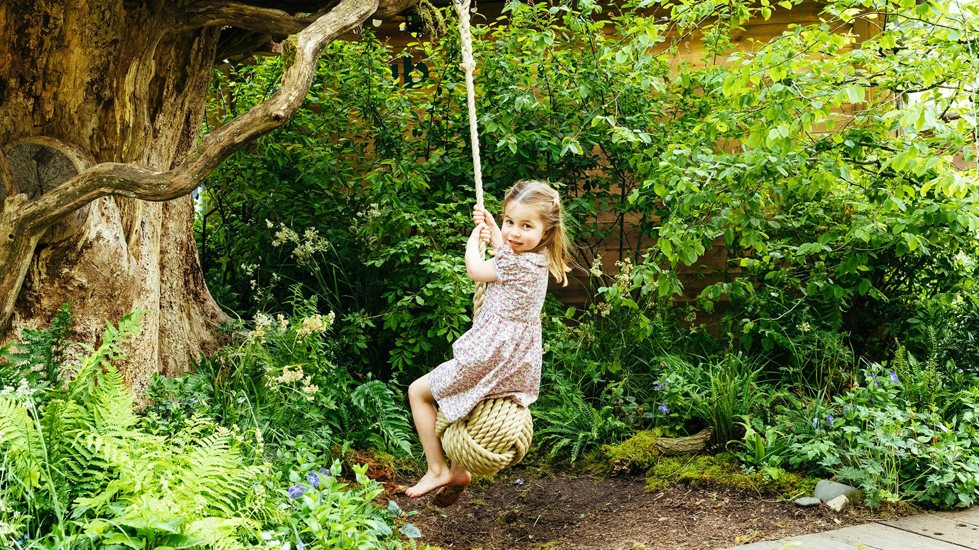 Princess Charlotte, daughter of Prince William and Kate, Duchess of Cambridge plays in the Adam White and Andree Davies co-designed garden ahead of the RHS Chelsea Flower Show in London, May 19, 2019.