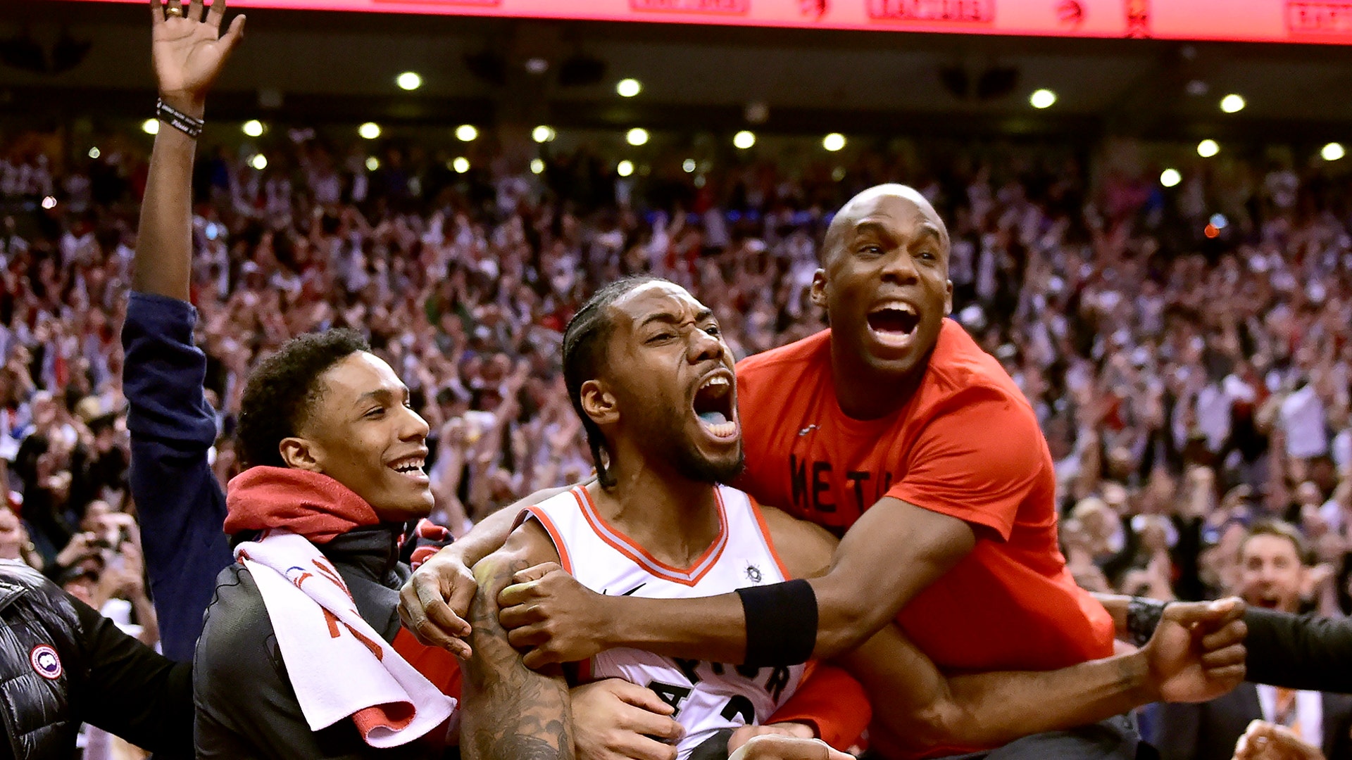Toronto Raptors forward Kawhi Leonard celebrates his last-second series-winning basket with teammates against the Philadelphia 76ers in Toronto, May 12, 2019.
