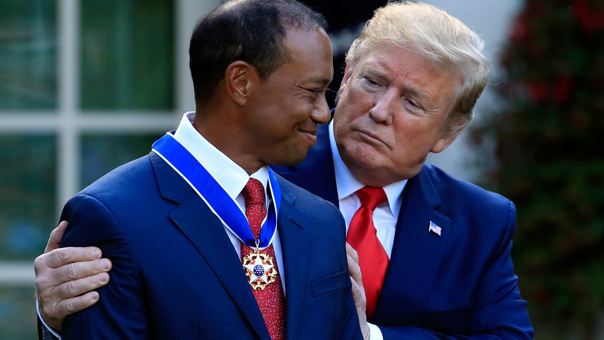 President Donald Trump awards the Presidential Medal of Freedom to Tiger Woods during a ceremony in the Rose Garden of the White House in Washington, May 6, 2019. 