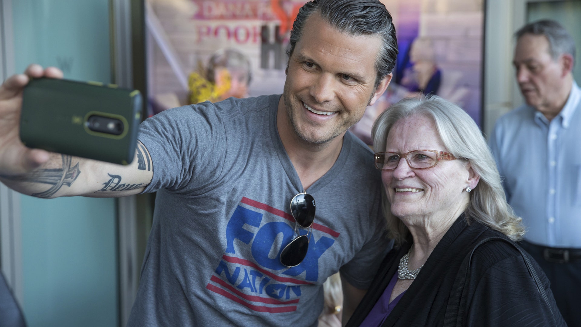 Pete Hegseth takes a picture with a loyal Fox News fan at the Fox Nation summit.