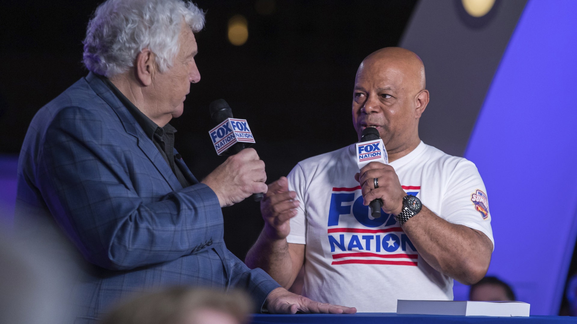 David Webb and Bill Bennett at the Fox Nation summit's live show for fans and subscribers.