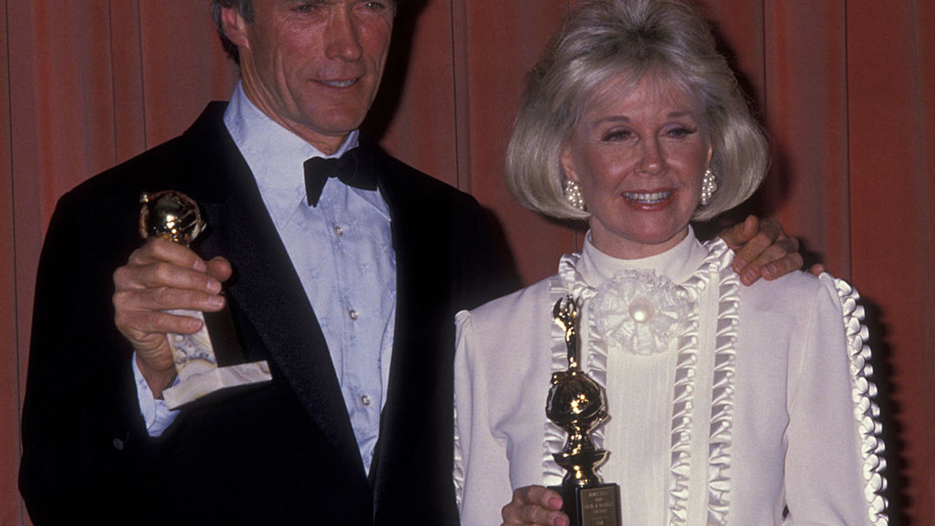 Clint Eastwood and actress Doris Day attend the 1989 Golden Globes in Los Angeles.
