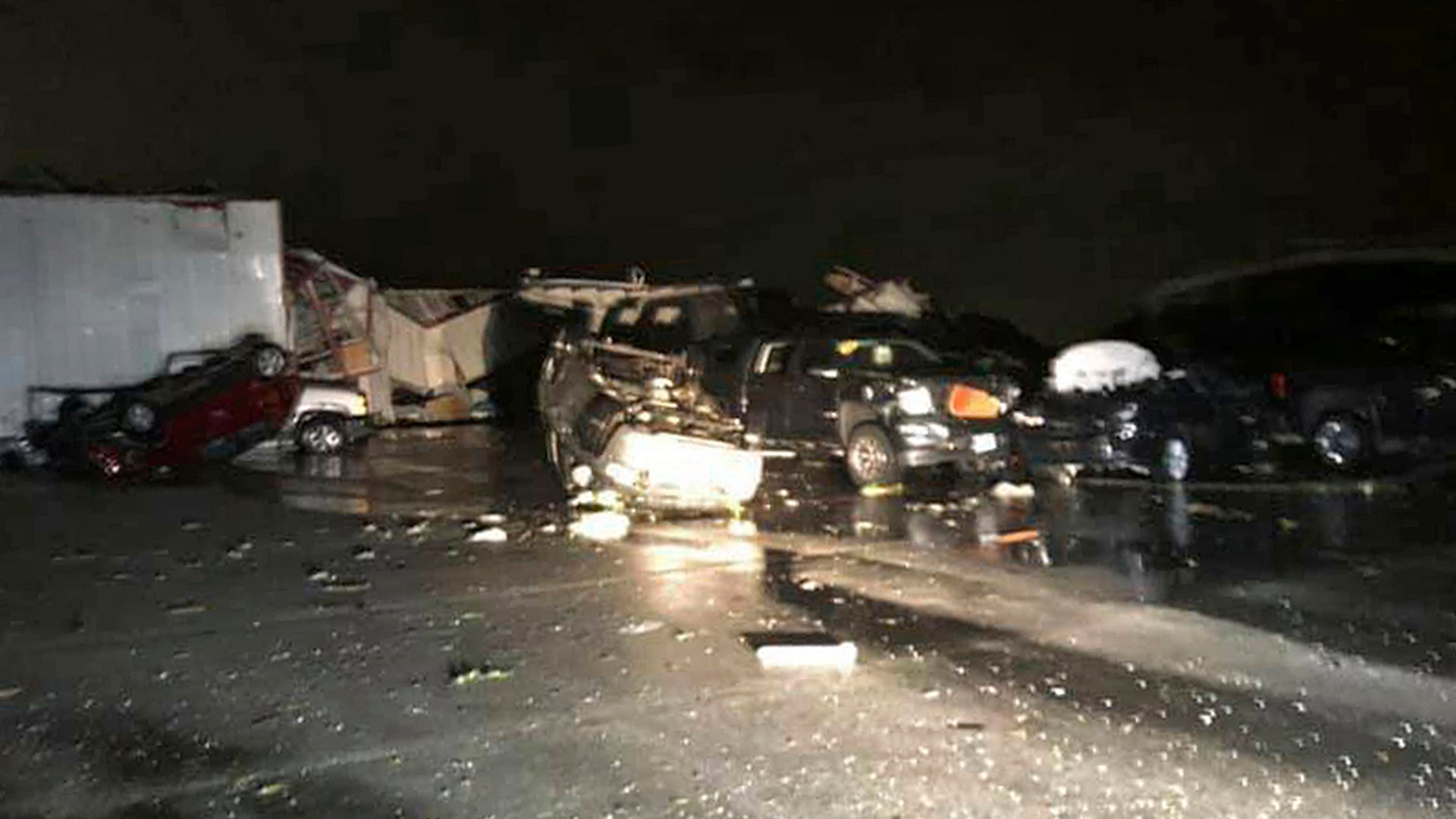 This image provided by John Dolson shows the damage of a car dealership in Jefferson City. (John Dolson via AP)