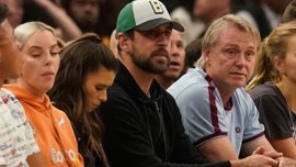 Milwaukee Bucks fan buys Danica Patrick's drink in front of Aaron Rodgers during playoff game