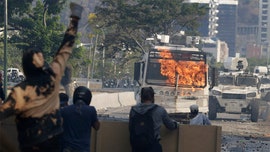 Venezuela’s Guaidó calls for general strike after clashes leave woman dead, dozens injured