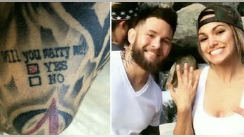 MMA fighter proposes to girlfriend using tattoo