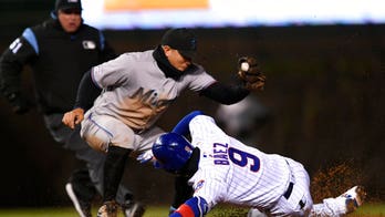 Cubs fan appears to gesture white power symbol live on-air