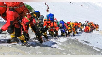 California woman who broke Everest climbing record saw four bodies during expedition, says rules must change to stop deaths