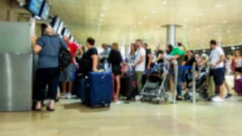 Woman claims airline employee called husband 'a killer' after learning he's a cop; American Airlines issues apology