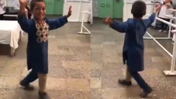 Afghan boy, 5, does happy dance with new prosthetic leg