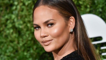 Chrissy Teigen reveals she has breast implants, wants them removed 'now'