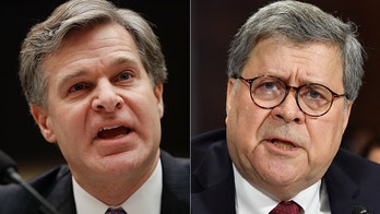 Split with Barr? FBI Director Wray says surveillance not the same as ‘spying’