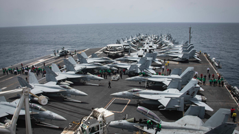 US aircraft carrier seen as barometer of tensions with Iran