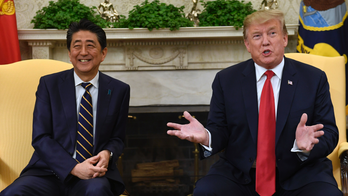 Japan welcomes Trump with a charm campaign, golf and sumo