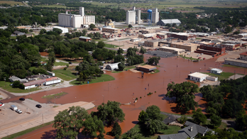 The Latest: Arkansas River town ordered evacuated