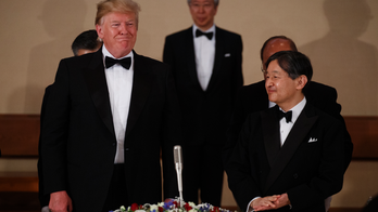 The Latest: Trump visits Japanese troops aboard destroyer