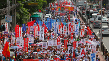 The Latest: May Day: German unions urge against nationalism