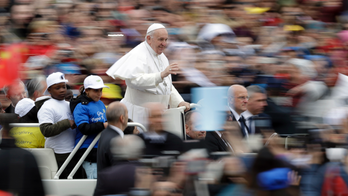 Pope gives joyride to migrant kids newly arrived in Italy