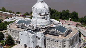 The Latest: 11 structured destroyed, 157 damaged in Missouri