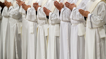 Pope ordaining 19 men to priesthood in St. Peter's Basilica
