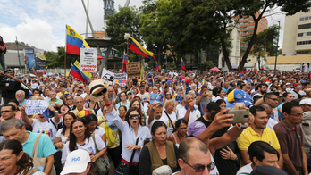 The Latest: Guaidó asks for relations with US military