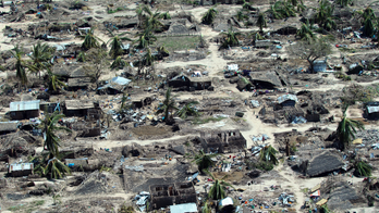 On cyclone-shattered island in Mozambique, shock and debris