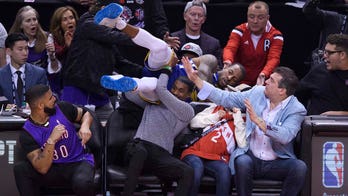 Drake avoids collision with Golden State’s Andre Iguodala during NBA Finals Game 1 in Toronto