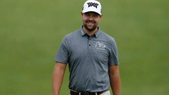 Moore's 65 leads by 1 at Memorial as Woods rallies for 70