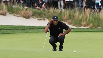 Executive pays thousands to caddie for Tiger Woods at golf event