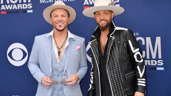 LOCASH says the military makes them proud Americans: Troops 'fight for us every day' so we can have 'freedom'