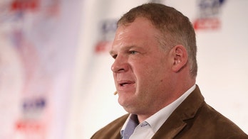 Mayor 'Kane' dons WWE mask, chokeslams man through table during symposium