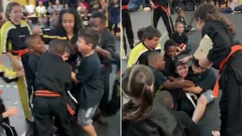 Little boy, cheered on by karate classmates, finally breaks board in adorable viral video