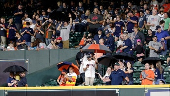 Houston Astros fans brave torrential downpour even with stadium roof closed