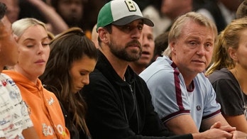 Milwaukee Bucks fan buys Danica Patrick's drink in front of Aaron Rodgers during playoff game