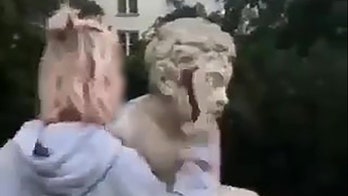 Instagram model blasted for vandalizing historic statue