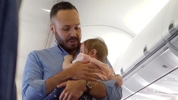 Southwest flight attendant comforts crying baby in viral video