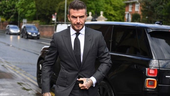 Red card: David Beckham gets 6-month driving ban after getting caught with phone in hand