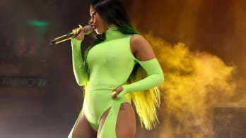 Cardi B wows in tight yellow outfit at Fashion Nova party performance