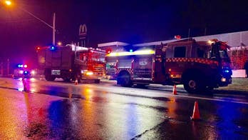 Woman crashes through McDonald's drive-thru into kitchen