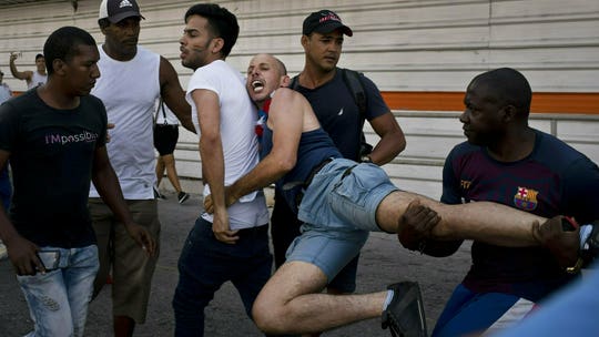 Cuban authorities arrest LGBT activists after banning march over grounds foreign powers could use it to criticize human rights